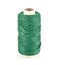 A spool of green sewing thread