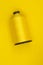 A spool of yellow thread on a yellow background. Sewing thread. Shoe industry