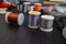 Spools of thread and close-up set of various fly tying accessories for fly fishing