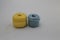 Spools of Yellow and Blue Thread