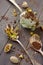 Spoon with chopped pistachios and homemade pistachio ice cream on rustic wooden background