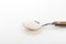 Spoon of fine granulated sugar  on white  - Image