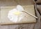 Spoon flour on a wooden board