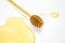 Spoon with fresh honey spilled on a white background. organic vitamin food