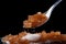 A spoon full of sugar and sugar cubes in a close-up shot, perfect to sweeten your morning coffee, Close-up depiction of organic