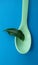 Spoon with leaf. Natural ingredients. Healthy food concept.