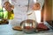 Spoon pours liquid on meat.