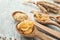 Spoon with wheat pasta on wooden table