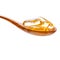 Spoonful of gel capsules of omega 3. Close up capsules fish oil