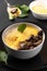 A spoonful of porridge on a dark background. Porridge polenta is a classic Italian dish. Vertical Frame