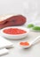 Spoonful of red fish caviar