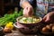 spooning a second helping of corn chowder into a rustic ceramic bowl