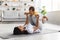 Sport Activities With Baby. Black Mom Exercising With Infant Son At Home