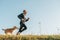 Sport activity with pet. Canicross exercises. Man runs with his