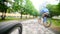 Sport bike - Bicycle wheels and road perspective riding summer. Closeup riding a Bicycle wheel