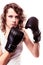 Sport boxer woman in black gloves. Fitness girl training kick boxing.