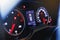 Sport car speedometer and fuel indicator. Close up view