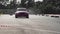 Sport car wheel drifting. Blurred of image diffusion race drift car with lots of smoke from burning tires on speed track. Sport co