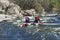 Sport catamaran on the rapid river