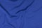 Sport Clothing Fabric Texture Background. Top View of Cloth Textile Surface. Blue Football Shirt With Copyspace.