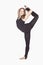 Sport Concepts. Young Caucasian Rhythmic Gymnast Sportswoman In Training Outfit During Legs Muscles Stretching Exercises Against
