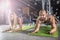 Sport couple doing plank exercise workout in fitness centrum. Man and woman practicing plank in the gym