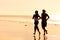 Sport couple jogging on the beach