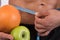 Sport and diet. Attractive man with muscular body. Athletic guy and fruits