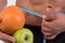 Sport and diet. Attractive man with muscular body. Athletic guy and fruits