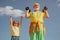 Sport exercise for kids. Lifting dumbbells. Portrait of senior man and cute child lifting dumbbells. Grandfather and son