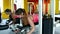 Sport exercises for legs. women athlet engaged in the gym and lift the weight of your feet