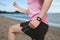 sport female wearing bright pink watchband bent touchscreen smartwatch
