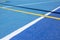 Sport field court background. Blue rubberized and granulated ground surface with white, yellow lines on ground. Top view