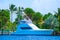 Sport fishing yacht with lush tropical background