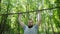 Sport, fitness, exercising people concept. Man doing pull-ups on horizontal bar
