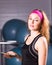 Sport, fitness, technology and people concept - young woman with smartphone in gym