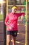 Sport, Fitness and Workout Concepts. Happy Smiling Caucasian Female Athlete in Professional Outfit Posing With Water Bottle