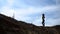 Sport girl stands on a Sandy Hill