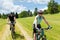 Sport happy couple riding bicycles in countryside