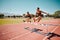 Sport, jump and women runner doing hurdles on stadium track, athlete running race and fitness training outdoor. Practice