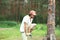 Sport, leisure - young man slacklining balancing on rope in the forest