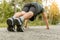 Sport man doing strength training exercise pushup at outdoor