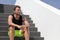 Sport man fitness active lifestyle portrait. Athlete sitting on stairs ready for workout training