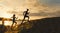 Sport motivations -group of athletes - two girls and a guy are fleeing the mountain, near river at dusk