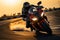 Sport motorcycles racing on a track, rider speeding at sunset