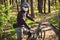 Sport. Mountain Bike cyclist riding single track. Man on bike wearing respirator face mask with heavy duty protective filter.