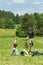 Sport mountain biking couple greeting in meadows