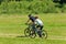 Sport mountain couple biking sunny meadows