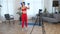 Sport muscular woman trains teaches student records online course on camera