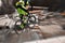 Sport race Mountain biker extreme and fun downhill track. Jumps and dirt splashes.